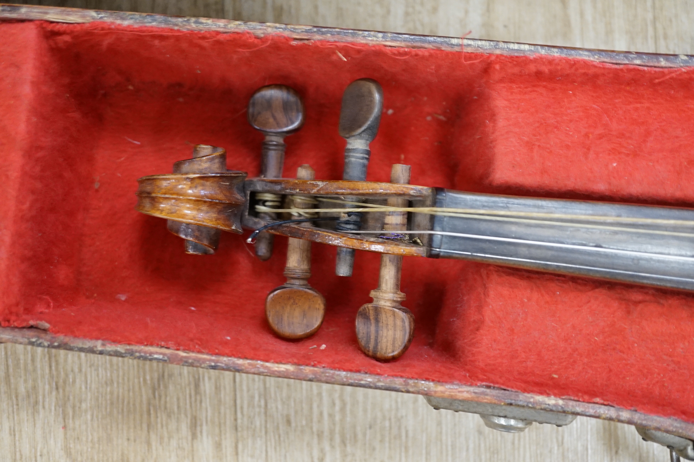 A cased early 20th century French violin and bow, label inside for Jerome Thibouville-Lamy, body length 36cm CITES Submission reference 5URFZXWK